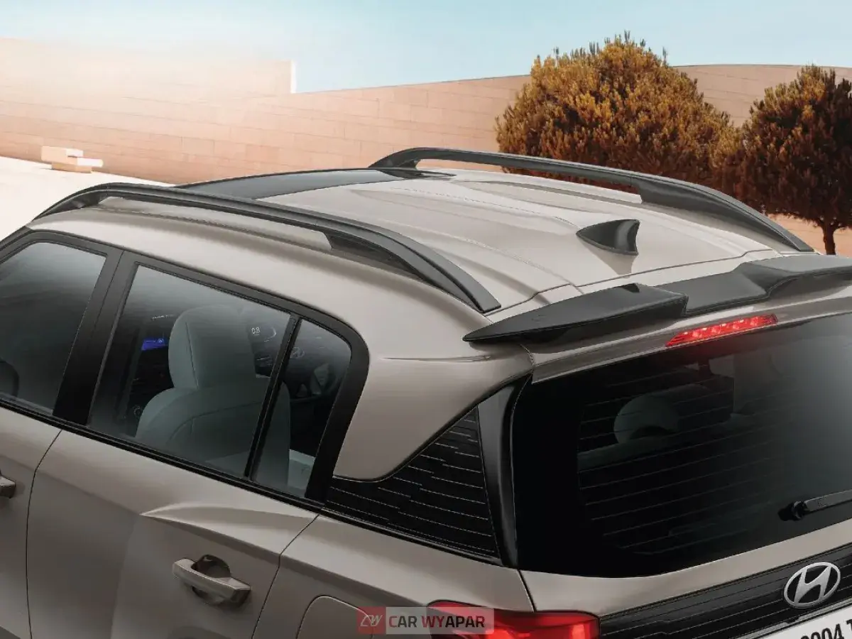 High-angle shot showing the roof rails and shark fin antenna.